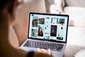 Shot of girl with laptop scrolling through social media